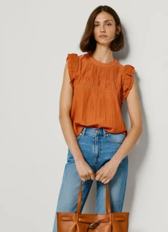 Blusa con detalles plisados