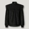 Blusa fluida con detalles metalizados Blusa fluida con detalles metalizados