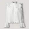 Blusa fluida con volantes Blusa fluida con volantes