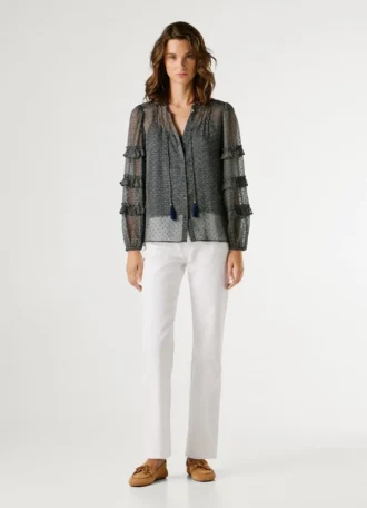 Blusa semitransparente con volantes