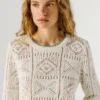 Jersey de punto calado con cuello redondo