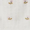 Top de punto calado con flores bordadas