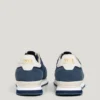 Zapatillas de cuero con detalles de ante
