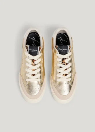 Zapatillas doradas con detalles de estampado animal